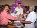 Presentation of bouquet by Thangella Trimurtulu to Ex Minister Sri pydikondala Manikyala Rao