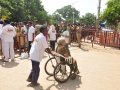 Peetham volunteers helping elderly people at Gowthami ghat